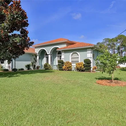 Buy this 4 bed house on Grand Club Cypress Course in Evanston Place, Palm Coast