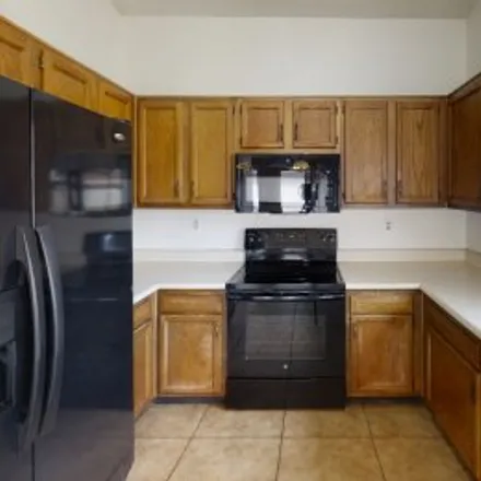 Rent this 4 bed apartment on 10026 West Roma Avenue in Laurelwood at Villa de Paz, Phoenix