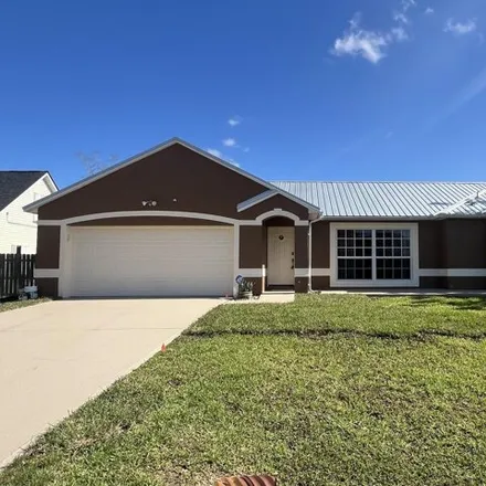 Rent this 4 bed house on 713 Rostock Circle Northwest in Palm Bay, FL 32907