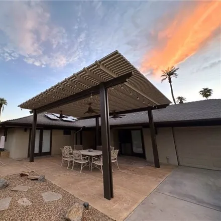 Rent this 4 bed house on 46542 Cameo Palm Drive in La Quinta, CA 92253