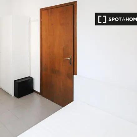 Rent this 4 bed room on Eco Store in Viale Tibaldi, 20136 Milan MI