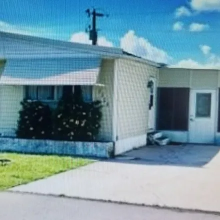 Buy this 2 bed house on 94 Galaxy Way in Tamiami Village & RV Park, Lee County