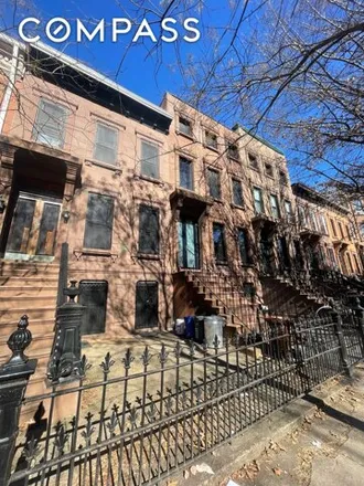 Buy this 6 bed townhouse on 433 Putnam Avenue in New York, NY 11221