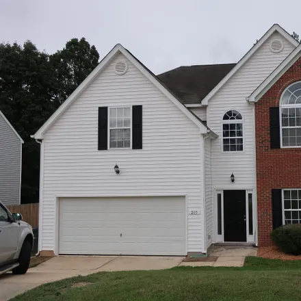 Rent this 4 bed loft on 205 Pyracantha Drive in Holly Springs, NC 27540