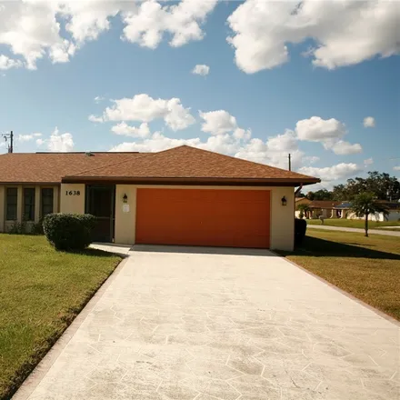 Rent this 3 bed house on 1638 Country Club Parkway in Lehigh Acres, FL 33936
