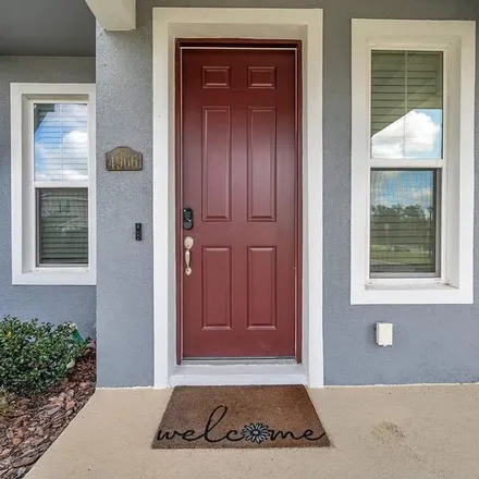 Rent this 3 bed townhouse on Avalon Park Boulevard in Pasco County, FL 33545