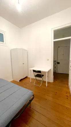 Rent this 4 bed room on Rua Doutor António Martins 3 in 1070-091 Lisbon, Portugal