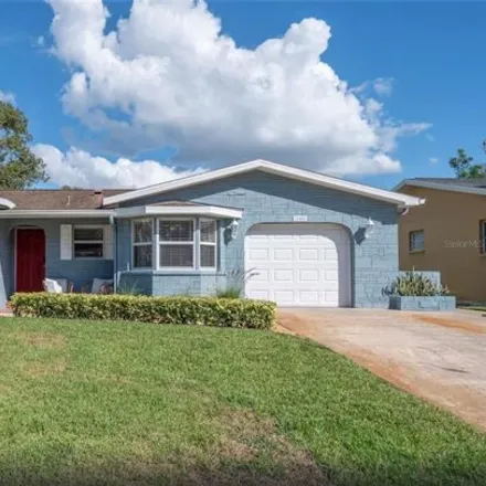 Buy this 3 bed house on 934 Wicks Drive in Lake Saint George, Palm Harbor