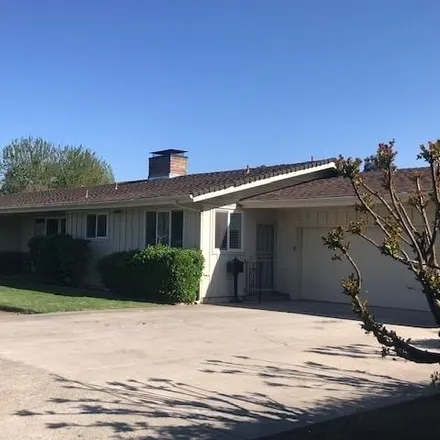 Buy this 4 bed house on 164 N Park Dr in Madera, California
