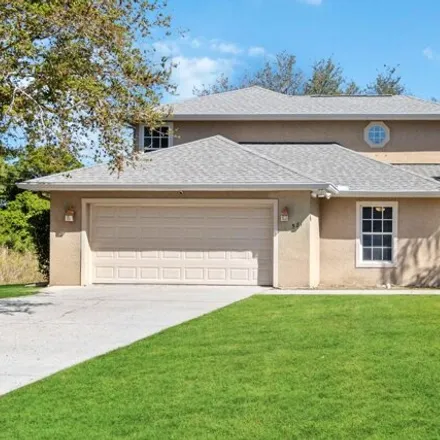 Buy this 4 bed house on 587 Seaport Terrace Southeast in Palm Bay, FL 32909