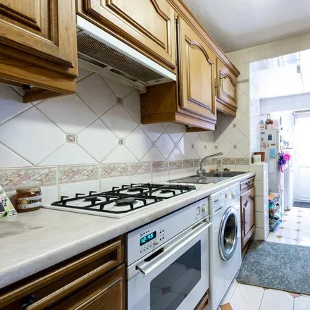 Rent this 3 bed townhouse on Harcourt Road in London, CR7 6BR