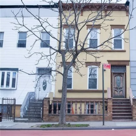 Buy this 4 bed house on 97 Utica Avenue in New York, NY 11213