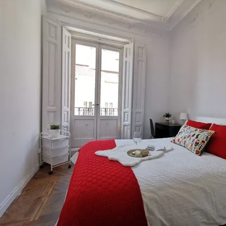 Rent this 11 bed room on Calle Preciados in 42, 28013 Madrid