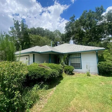 Buy this 3 bed house on 11669 Creek Dr in Alachua, Florida