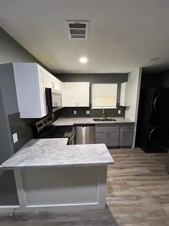 Rent this 2 bed house on 2640 Mills Street in Houston, TX 77026