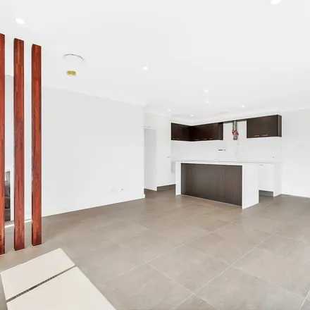 Rent this 3 bed townhouse on Eldridge Lane in Catherine Field NSW 2557, Australia