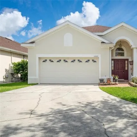 Buy this 4 bed house on 12329 Accipiter Dr in Orlando, Florida