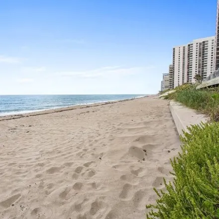 Rent this 2 bed condo on 5406 North Ocean Drive in Palm Beach Isles, Riviera Beach