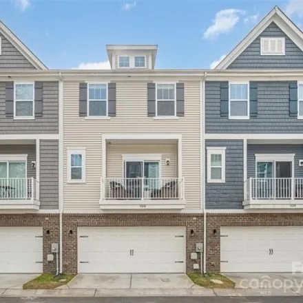 Buy this 4 bed townhouse on 1554 Sharon Road West in Sharonbrook, Charlotte
