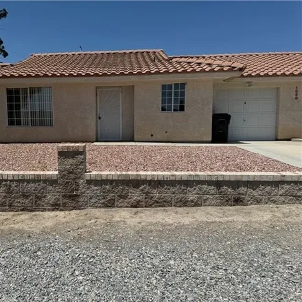 Rent this 2 bed house on 1058 East Calvada Boulevard in Pahrump, NV 89048