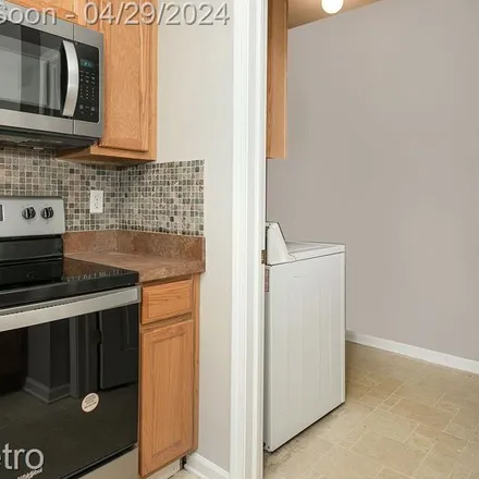 Rent this 2 bed apartment on 410 Village Drive in Walled Lake, Oakland County