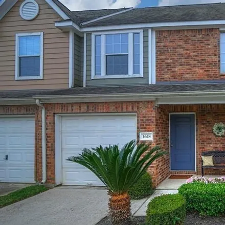Rent this 2 bed townhouse on 1614 Grable Cove Lane in Gleannloch Farms, TX 77379