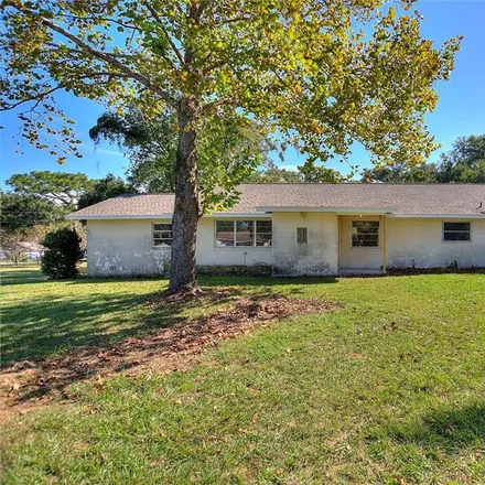 Buy this 4 bed house on 11918 Carmen Avenue in Pasco County, FL 33525