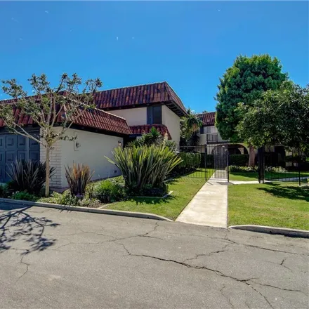 Buy this 2 bed townhouse on 3057 Club House Circle in Costa Mesa, CA 92626