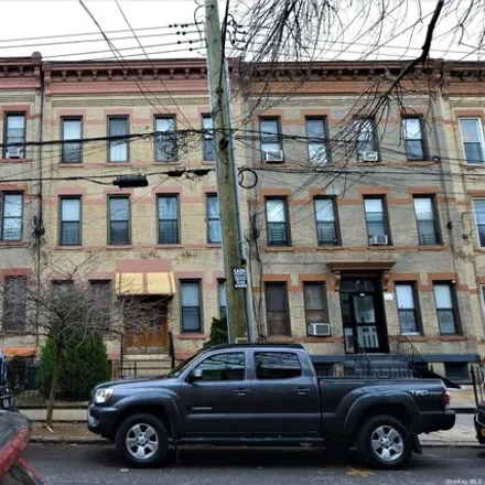 Buy this 12 bed house on 1718 Greene Avenue in New York, NY 11385