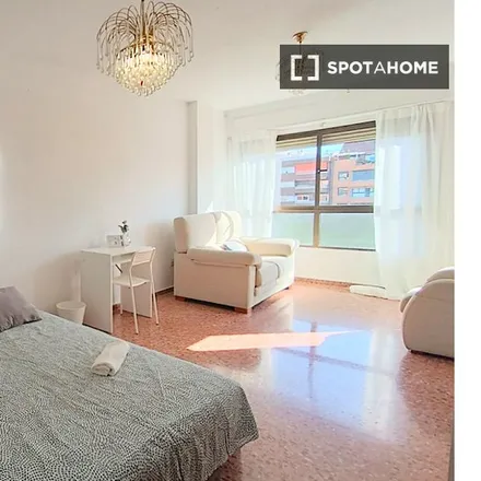 Rent this 5 bed room on Centro Social La Estacioneta in Carrer de l'Uruguai, 46007 Valencia