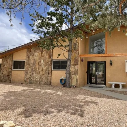 Buy this 4 bed house on 912 Cuatro Cerros Trail Southeast in Four Hills (HOA), Albuquerque