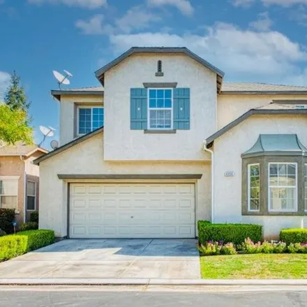 Buy this 4 bed house on 4014 West Pear Tree Lane in Fresno, CA 93722