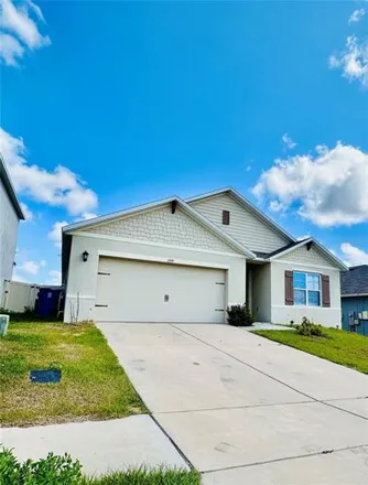 Rent this 4 bed house on Ludisia Loop in Davenport, Polk County