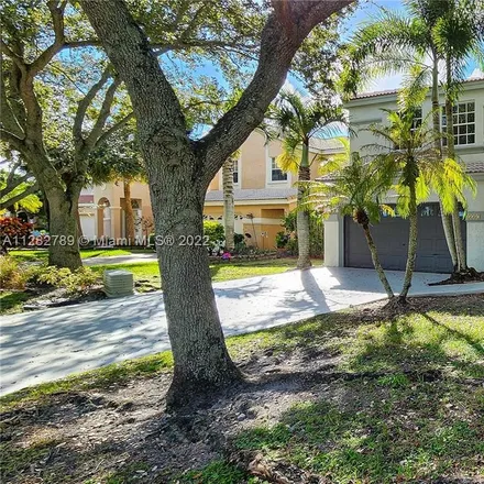 Rent this 4 bed house on 5587 Northwest 106th Drive in Kensington Manor, Coral Springs