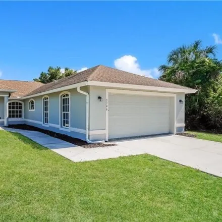 Rent this 4 bed house on 3304 13th Street West in Lehigh Acres, FL 33971