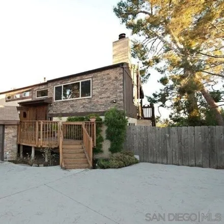 Rent this 4 bed house on 6861 Hyde Park Drive in San Carlos, San Diego