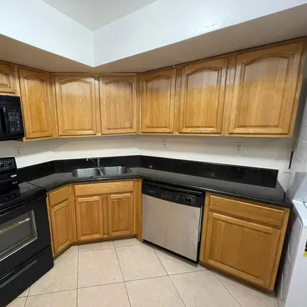 Rent this 3 bed condo on 7430 Southwest 82nd Street in Miami-Dade County, FL 33143