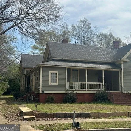 Buy this 4 bed house on 328 Warthen Street in Sandersville, GA 31082