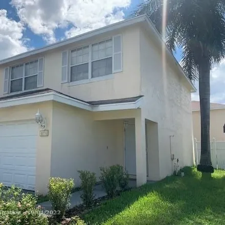 Rent this 4 bed house on 4095 Eastridge Circle in Bonnie Lock, Deerfield Beach