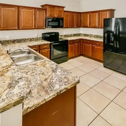 Rent this 3 bed apartment on 5217 Krenson Woods Way in Medulla, Polk County
