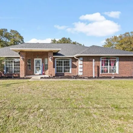 Buy this 4 bed house on 6612 Fairmont St in Navarre, Florida