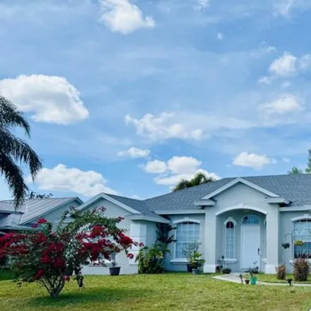 Buy this 3 bed house on 2568 Southwest Abelard Street in Port Saint Lucie, FL 34953