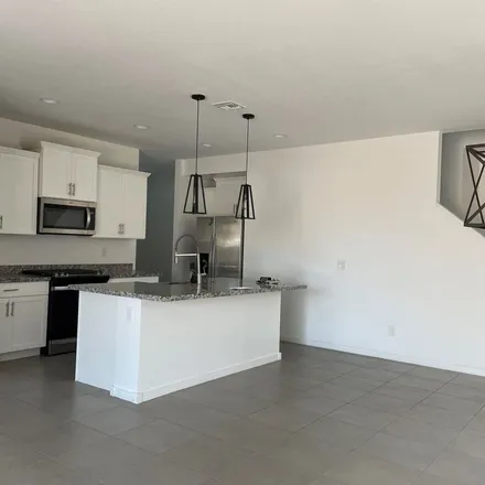 Rent this 4 bed apartment on 4368 West Samantha Way in Phoenix, AZ 85339