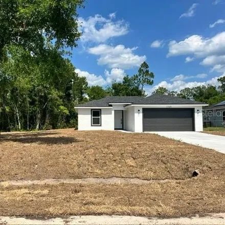 Buy this 3 bed house on 1765 5th Ave in Deland, Florida