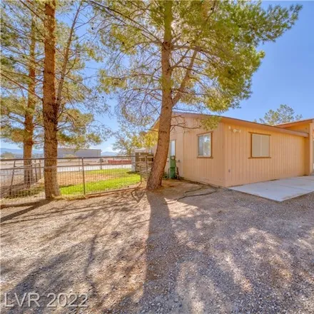 Buy this 4 bed house on 1598 West Charleston Park Avenue in Pahrump, NV 89048
