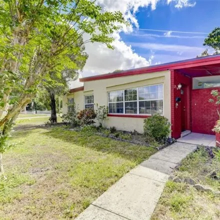 Buy this 3 bed house on 6124 Dahlia Drive in Orange County, FL 32807