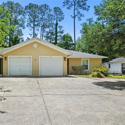 Buy this 6 bed house on 12 Emerald Lane in Palm Coast, FL 32164