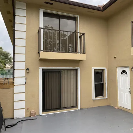 Rent this 3 bed townhouse on 1899 North Lawnwood Circle in Glidden Park, Fort Pierce