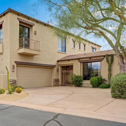 Buy this 4 bed townhouse on 9290 East Thompson Peak Parkway in Scottsdale, AZ 85255