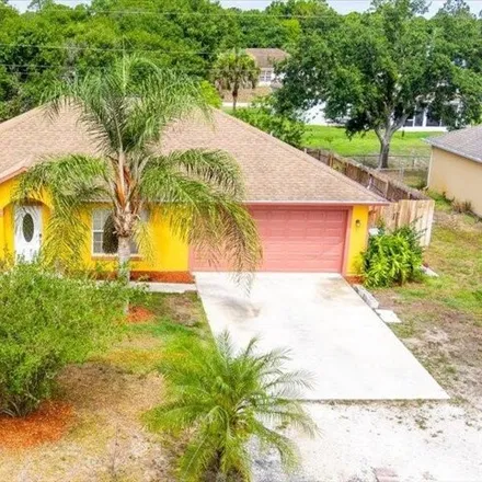 Buy this 3 bed house on 7965 105th Ave in Vero Beach, Florida